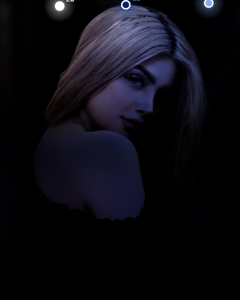 The portrait lit by three cold moonlight lamps from above